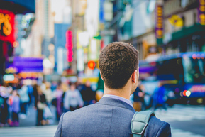 Business person with city background