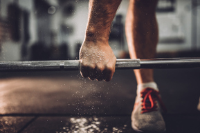 man lifting weights